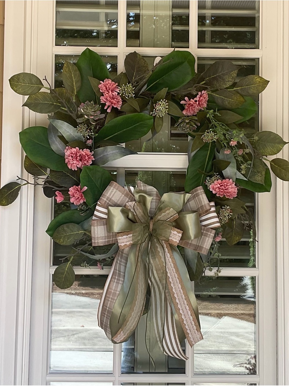 Elegant Magnolia Leaf Wreath with Pink Blossoms and Ribbon Bow